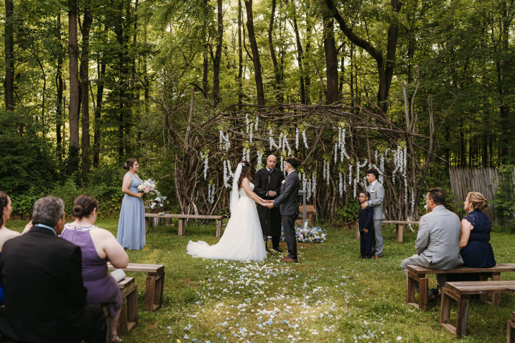 Couple getting married at a summer camp holding hands Sacajawea NJ